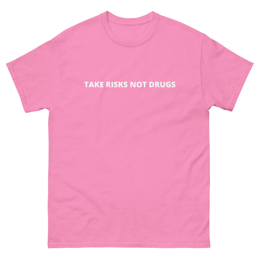 Take Risks, Not Drugs T-Shirt in pink with bold white lettering. Made from 100% cotton, offering comfort and style with an empowering message.